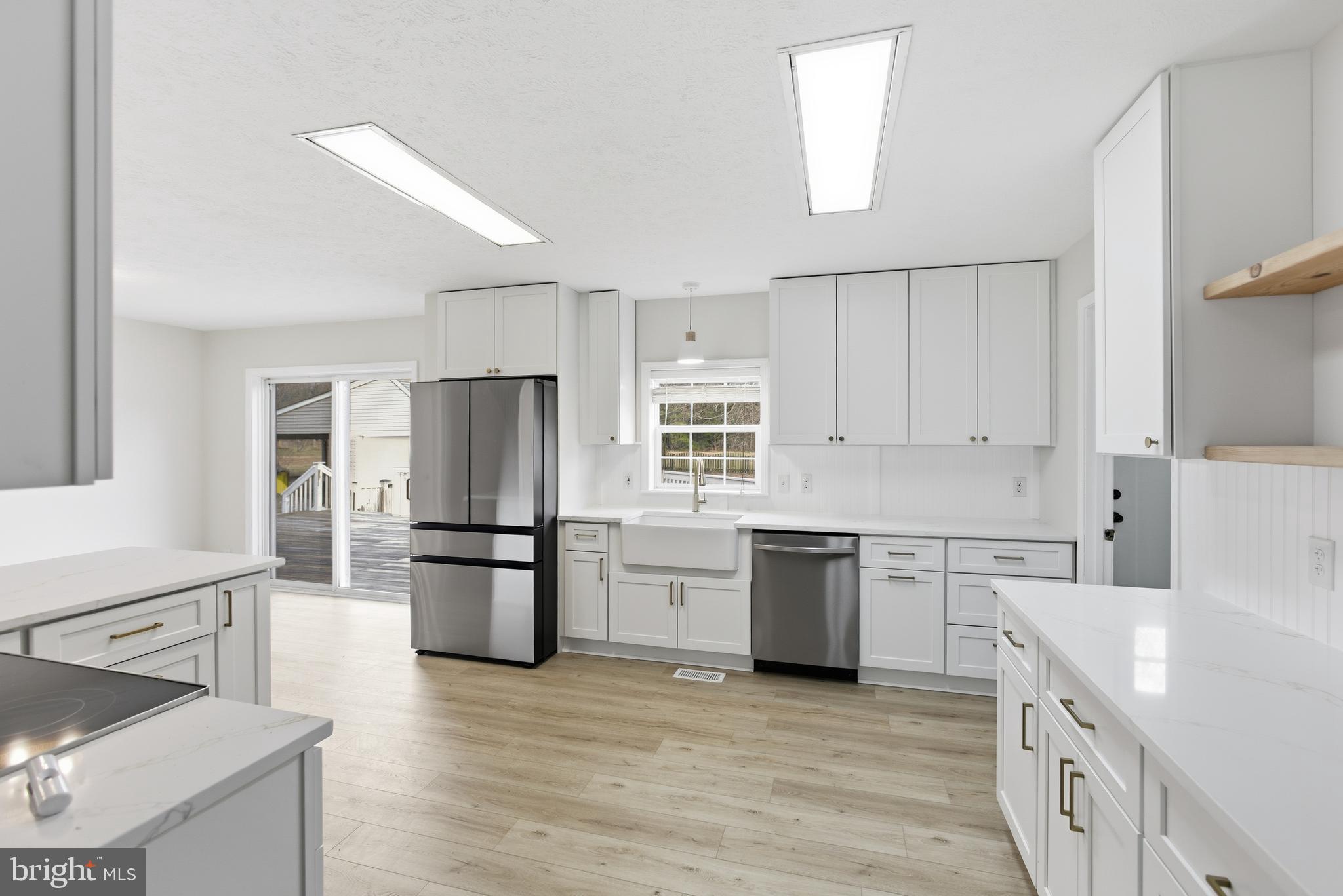 115 Gambrills Road Severn, MD 21144 - Photo 24 of 41 a kitchen with a refrigerator stove top oven and sink