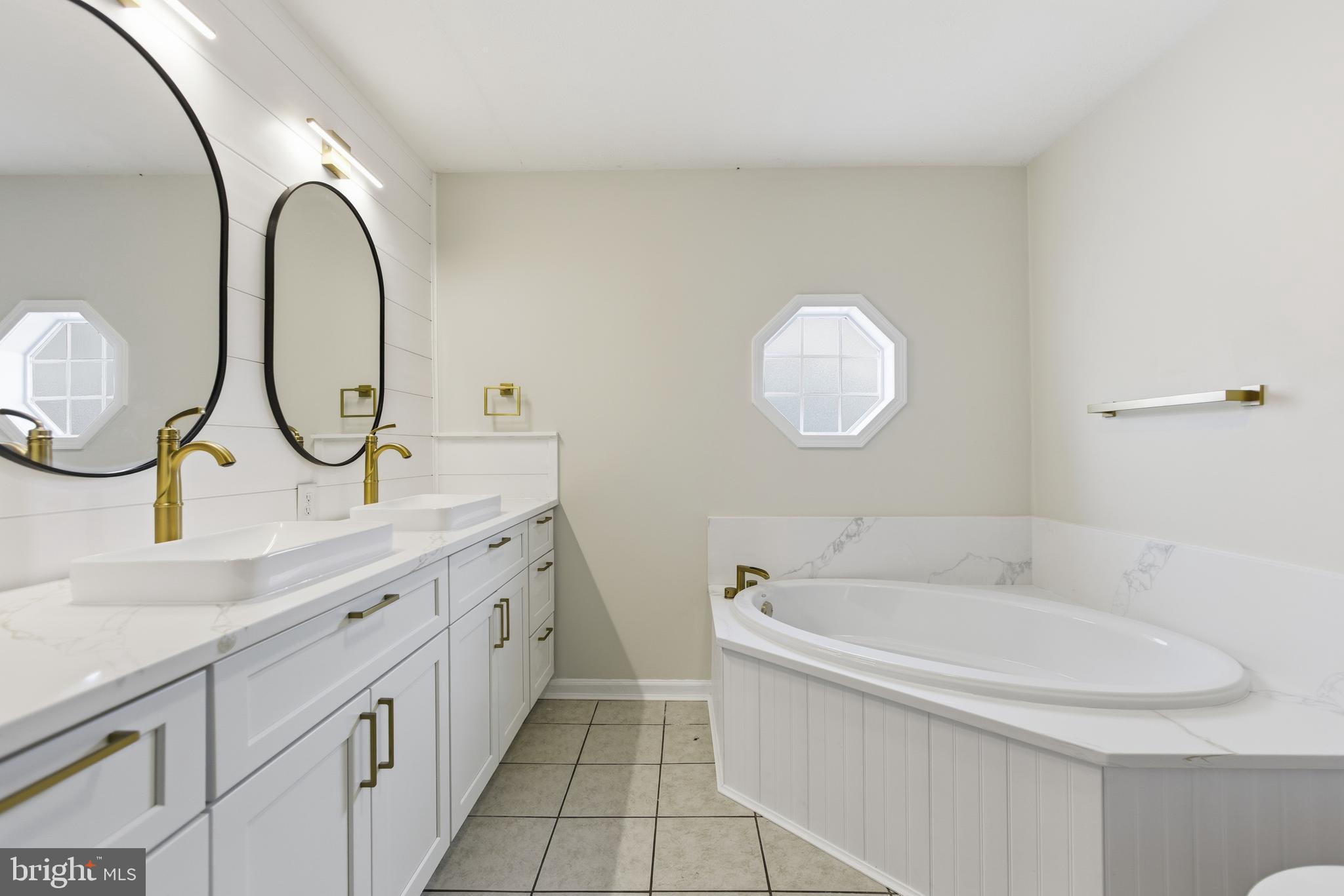 115 Gambrills Road Severn, MD 21144 - Photo 28 of 41 a bathroom with a sink and a mirror