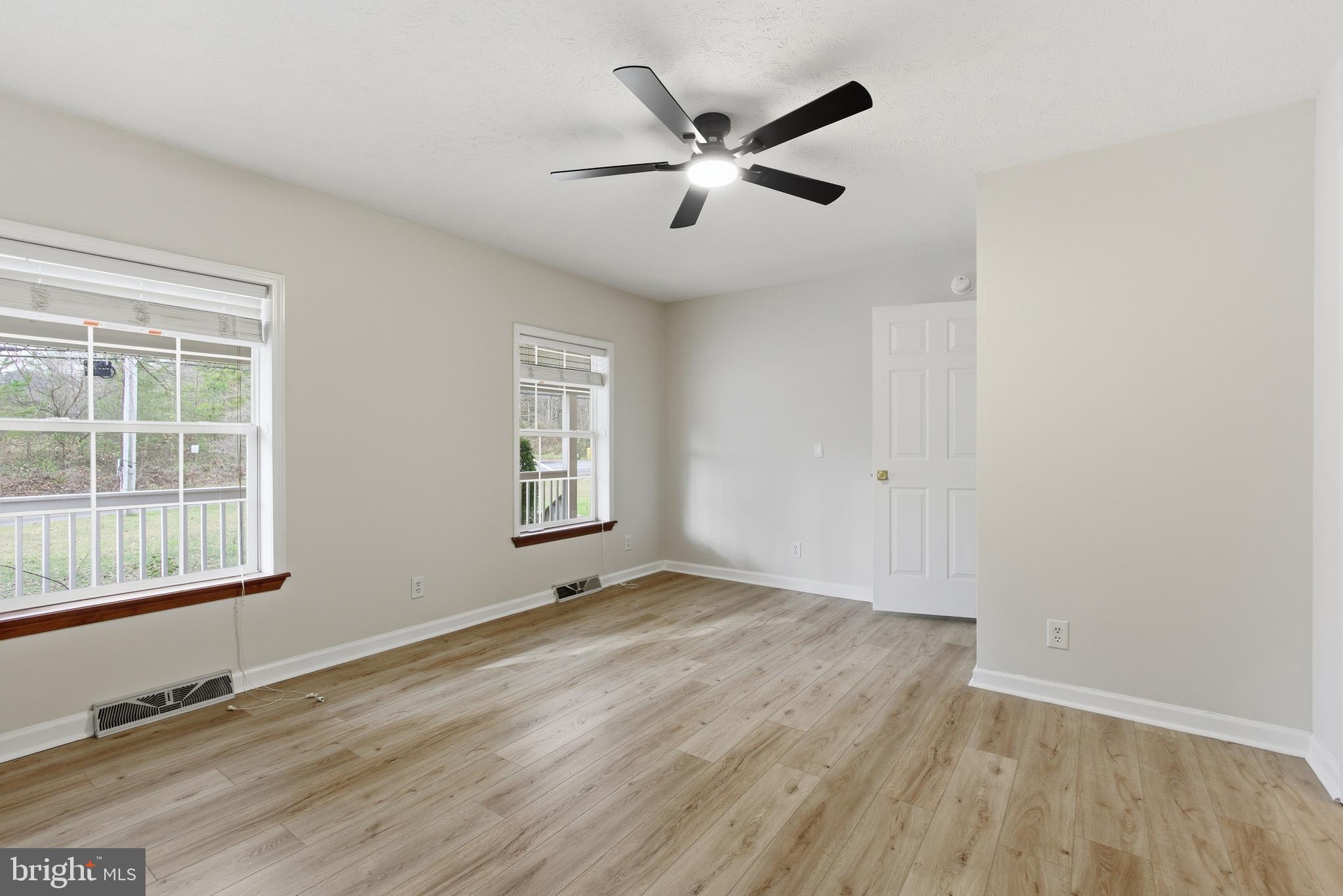 115 Gambrills Road Severn, MD 21144 - Photo 31 of 41 wooden floor in an empty room with a window