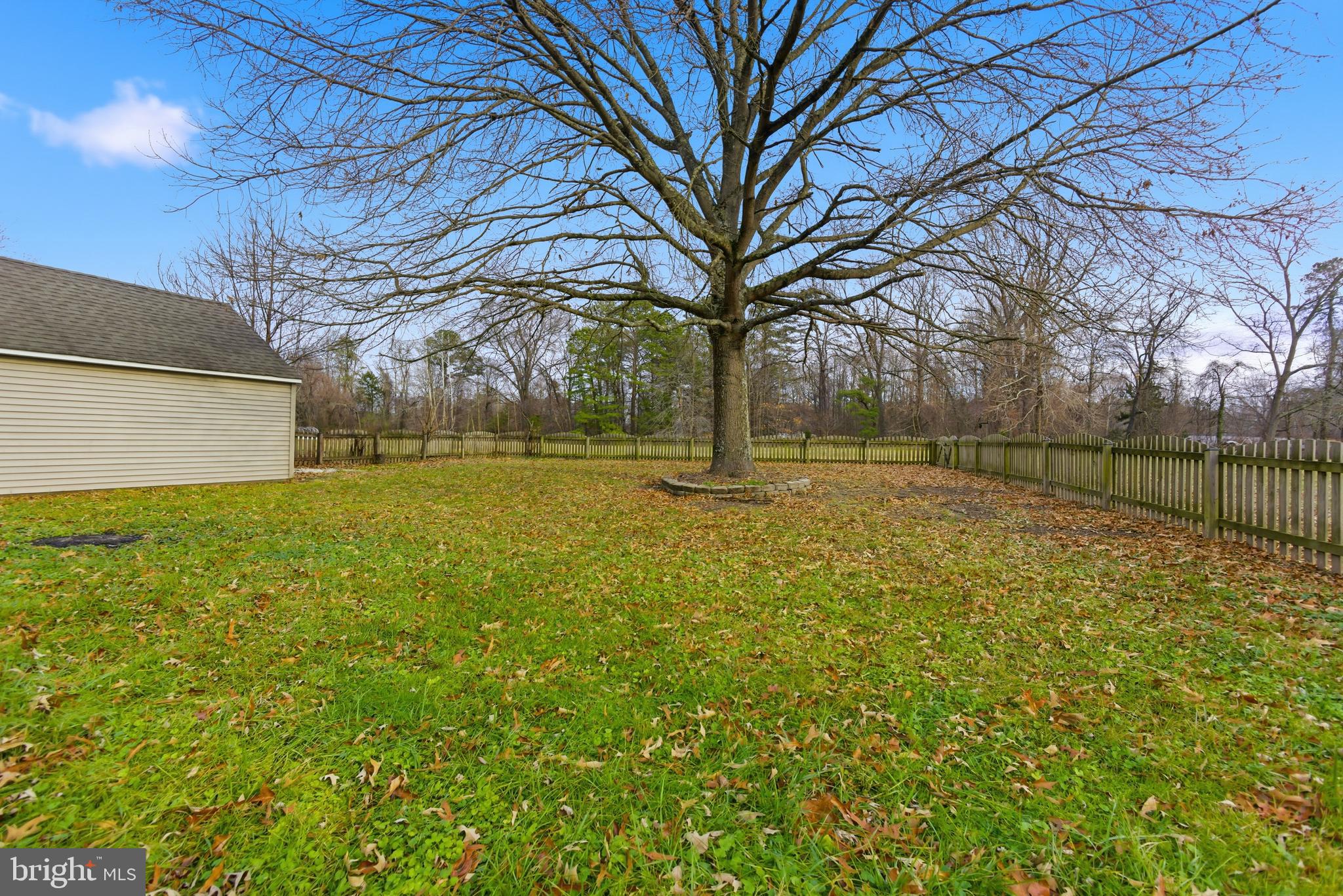 115 Gambrills Road Severn, MD 21144 - Photo 40 of 41 a backyard of a house with lots of green space