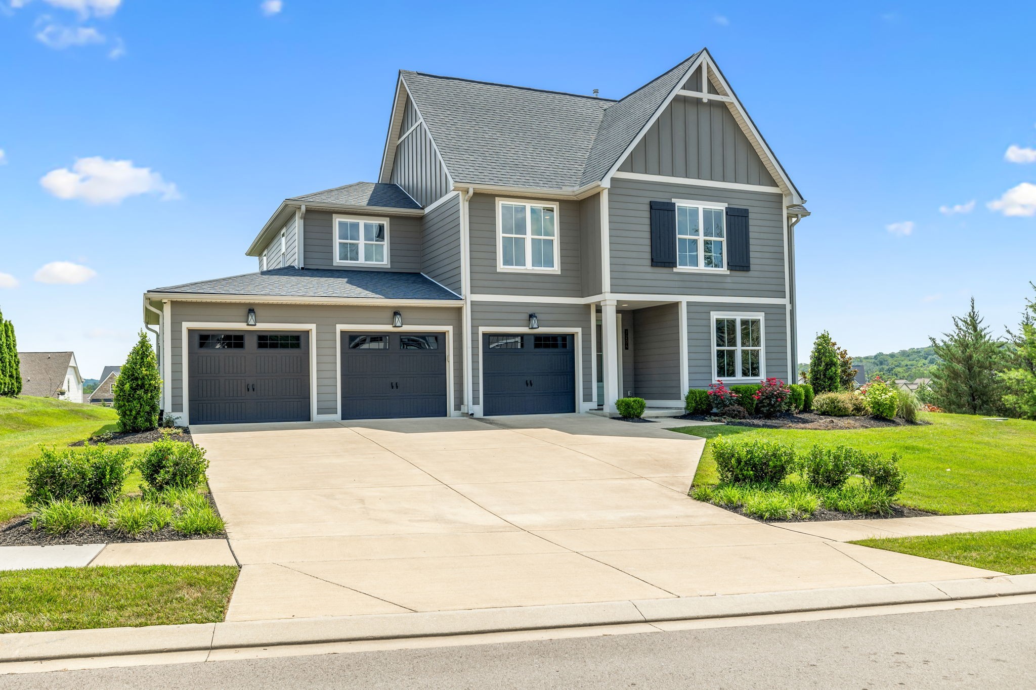 7204 Ludlow Drive College Grove, TN 37046 - Photo 2 of 59 a front view of a house with a garden