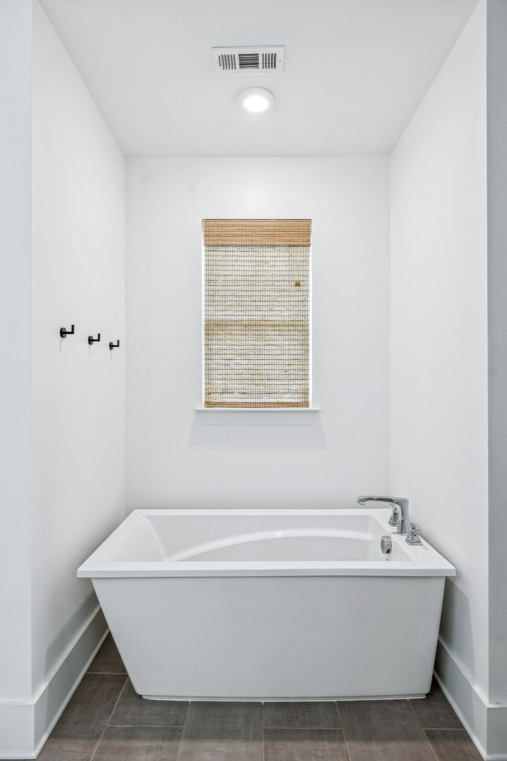 7204 Ludlow Drive College Grove, TN 37046 - Photo 22 of 59 a bathroom with a bathtub and window