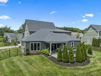 an aerial view of a house with a lake view
