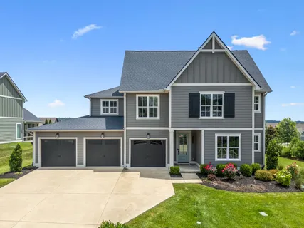 an aerial view of a house with outdoor space