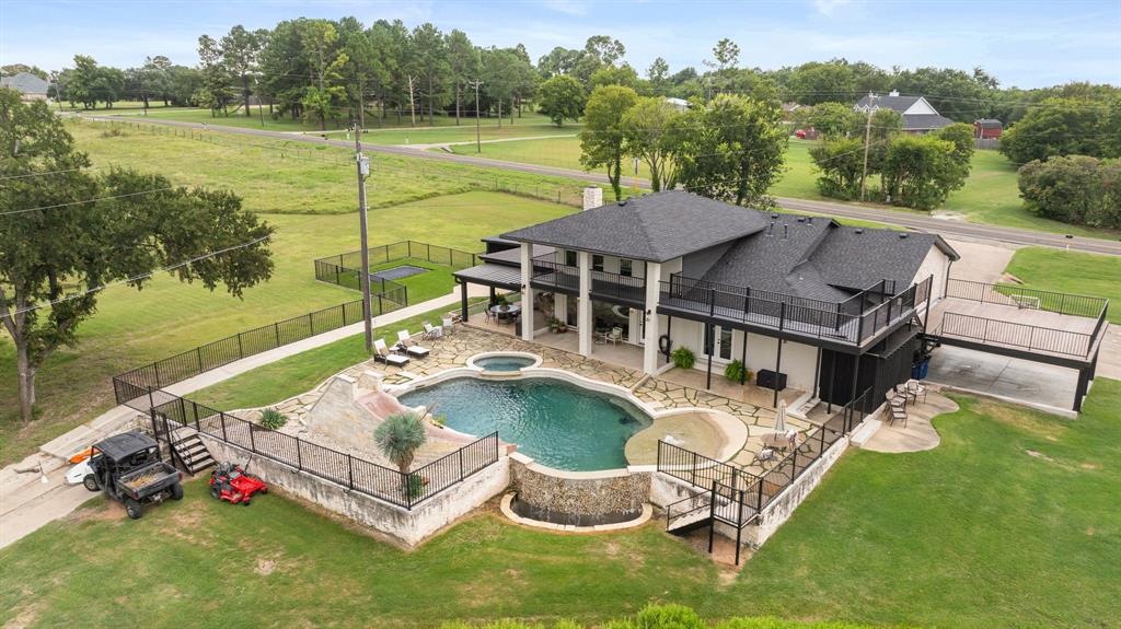 2402 Country Club Road Ennis, TX 75119 - Photo 24 of 33 an aerial view of a house having outdoor space patio and swimming pool