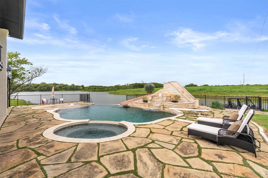 2402 Country Club Road Ennis, TX 75119 - Photo 25 of 33 an outdoor space with furniture and city view