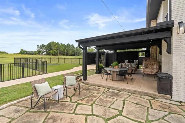 a view of chairs and tables in the balcony