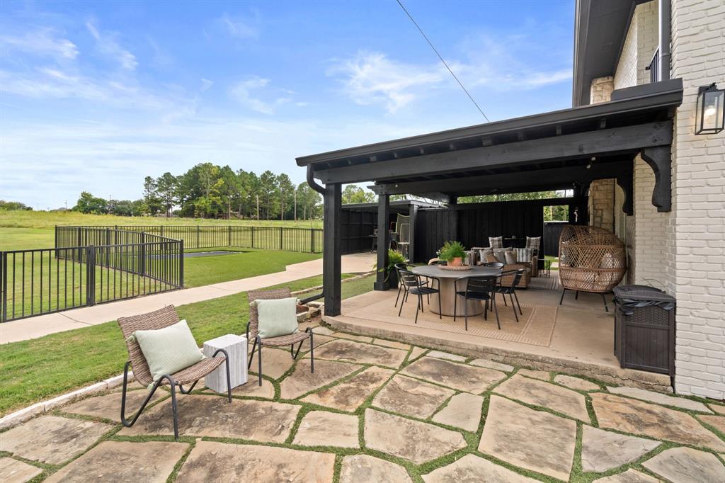 2402 Country Club Road Ennis, TX 75119 - Photo 26 of 33 a view of chairs and tables in the balcony