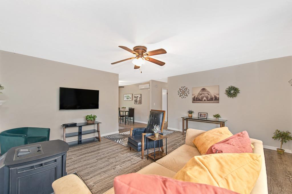 6689 Rhodes Avenue Placerville, CA 95667 - Photo 15 of 60 a living room with furniture and a flat screen tv