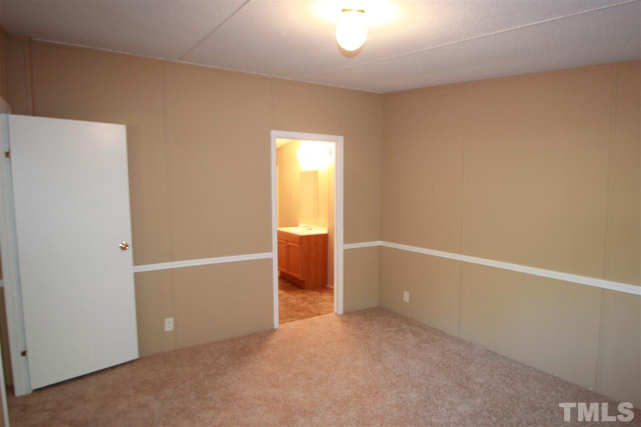 353 Oliver Loop Road Roxboro, NC 27574 - Photo 5 of 11 a view of an empty room