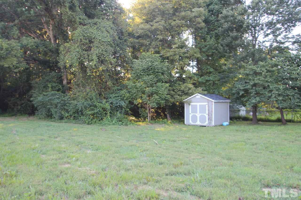 353 Oliver Loop Road Roxboro, NC 27574 - Photo 10 of 11 a view of a tiny house with a yard