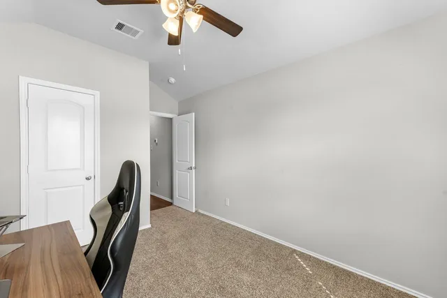 a view of a hallway with workspace