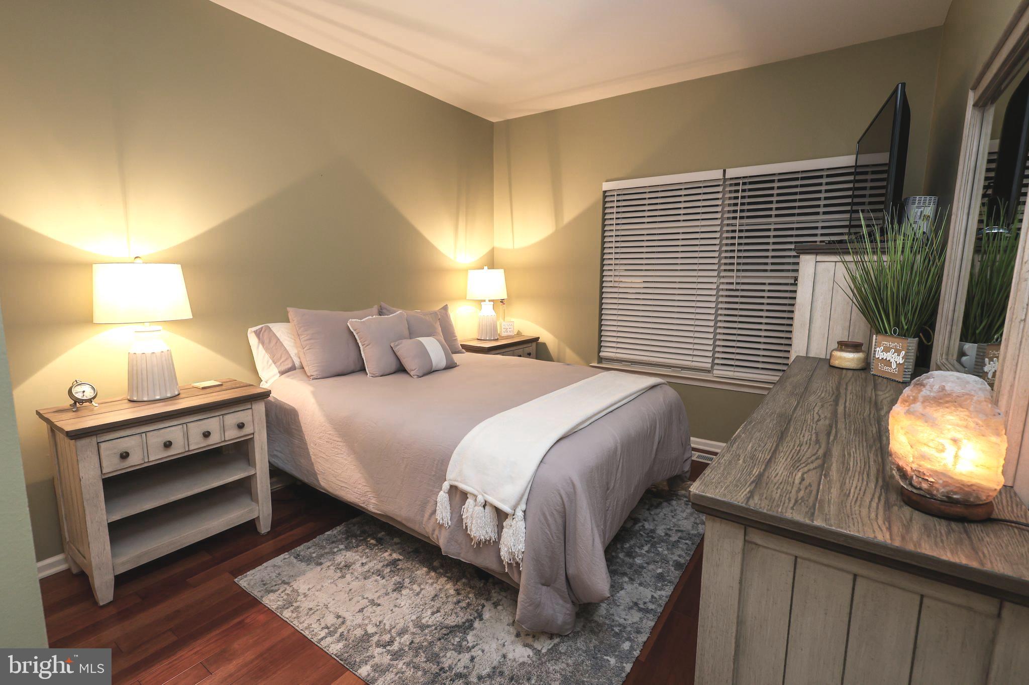 2602 Waterford Road Yardley, PA 19067 - Photo 20 of 33 a bedroom with a bed and wooden floor