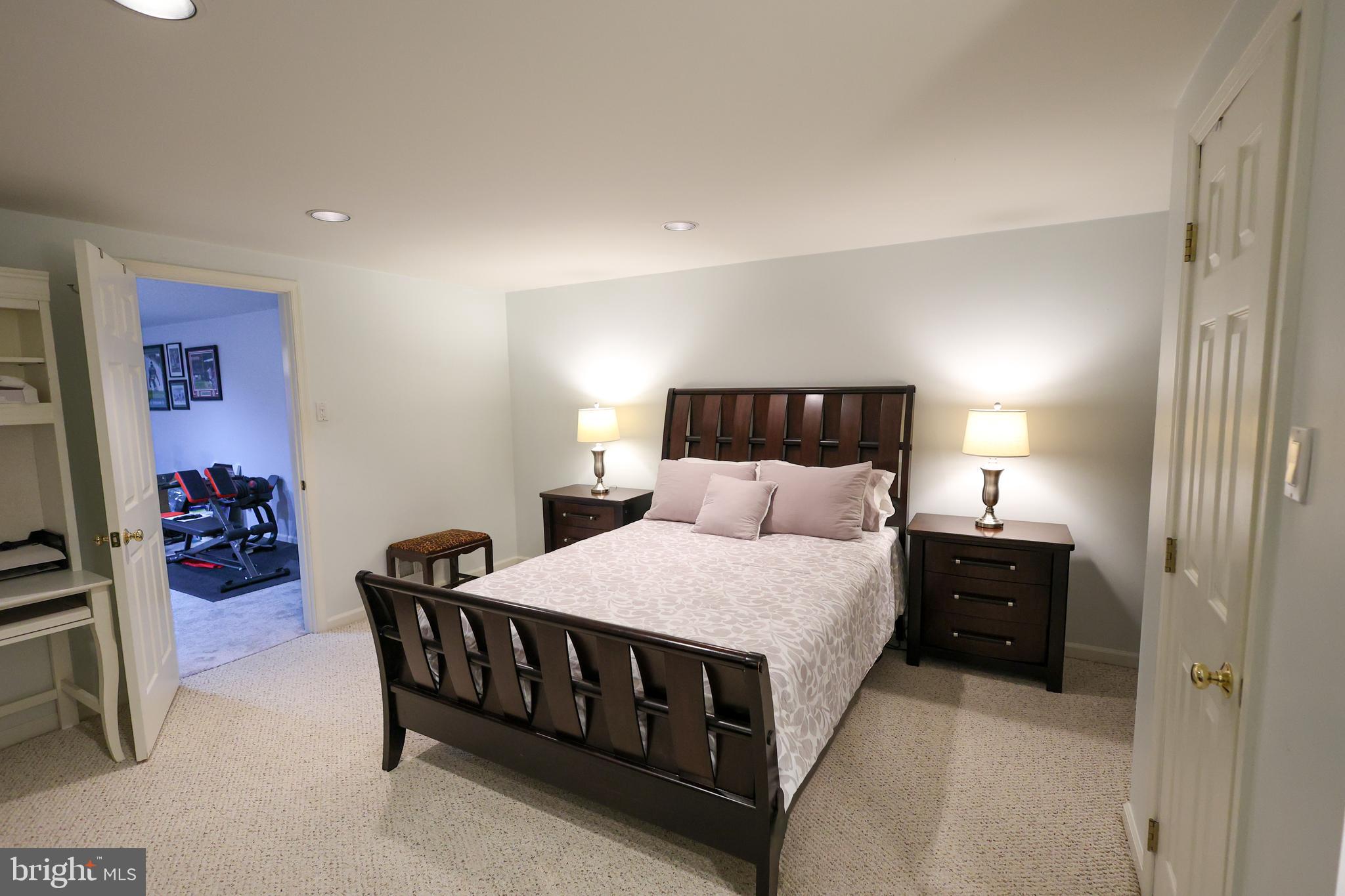 2602 Waterford Road Yardley, PA 19067 - Photo 27 of 33 a bedroom with a bed and a lamp on dresser