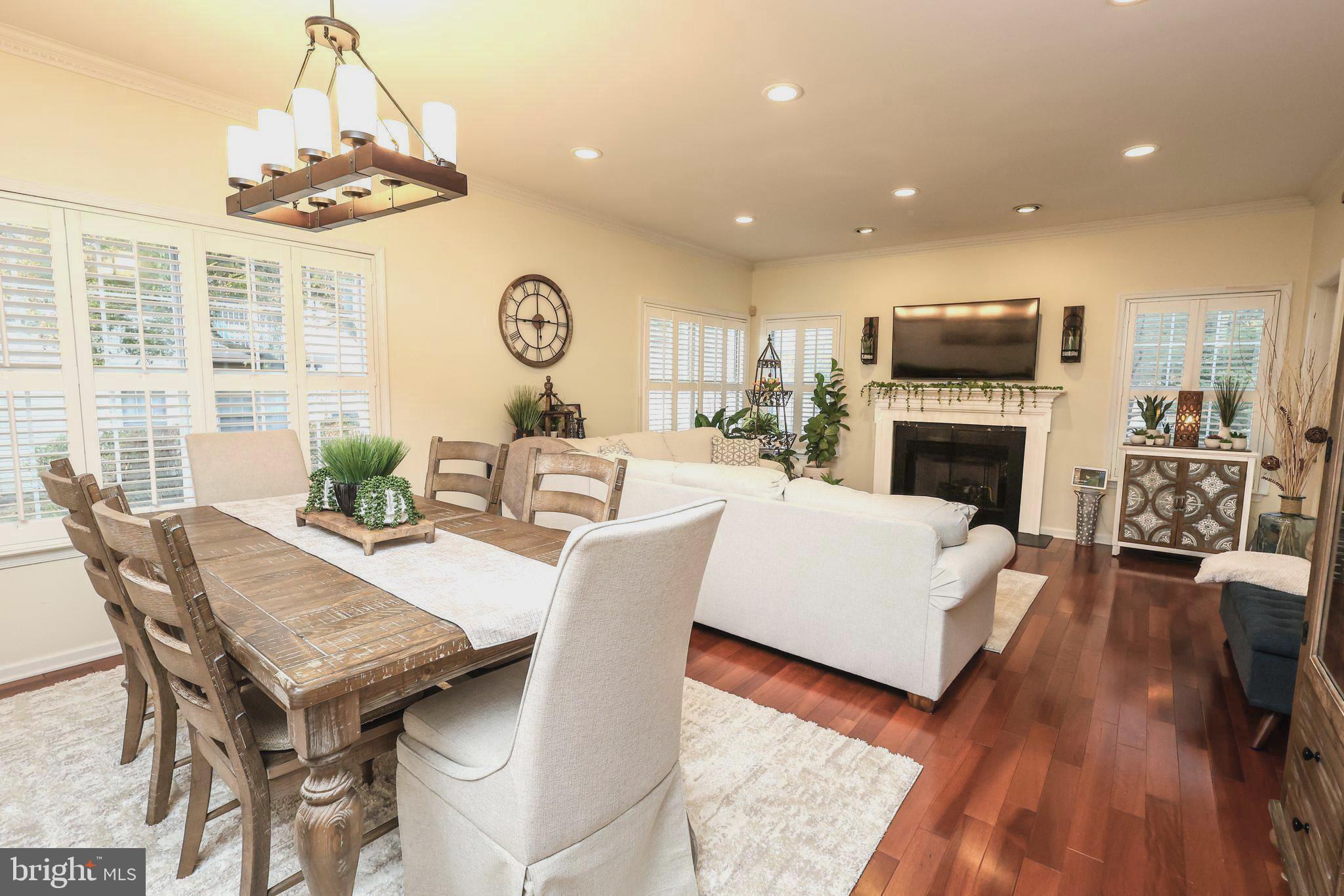 2602 Waterford Road Yardley, PA 19067 - Photo 3 of 33 a living room with furniture a fireplace and a chandelier