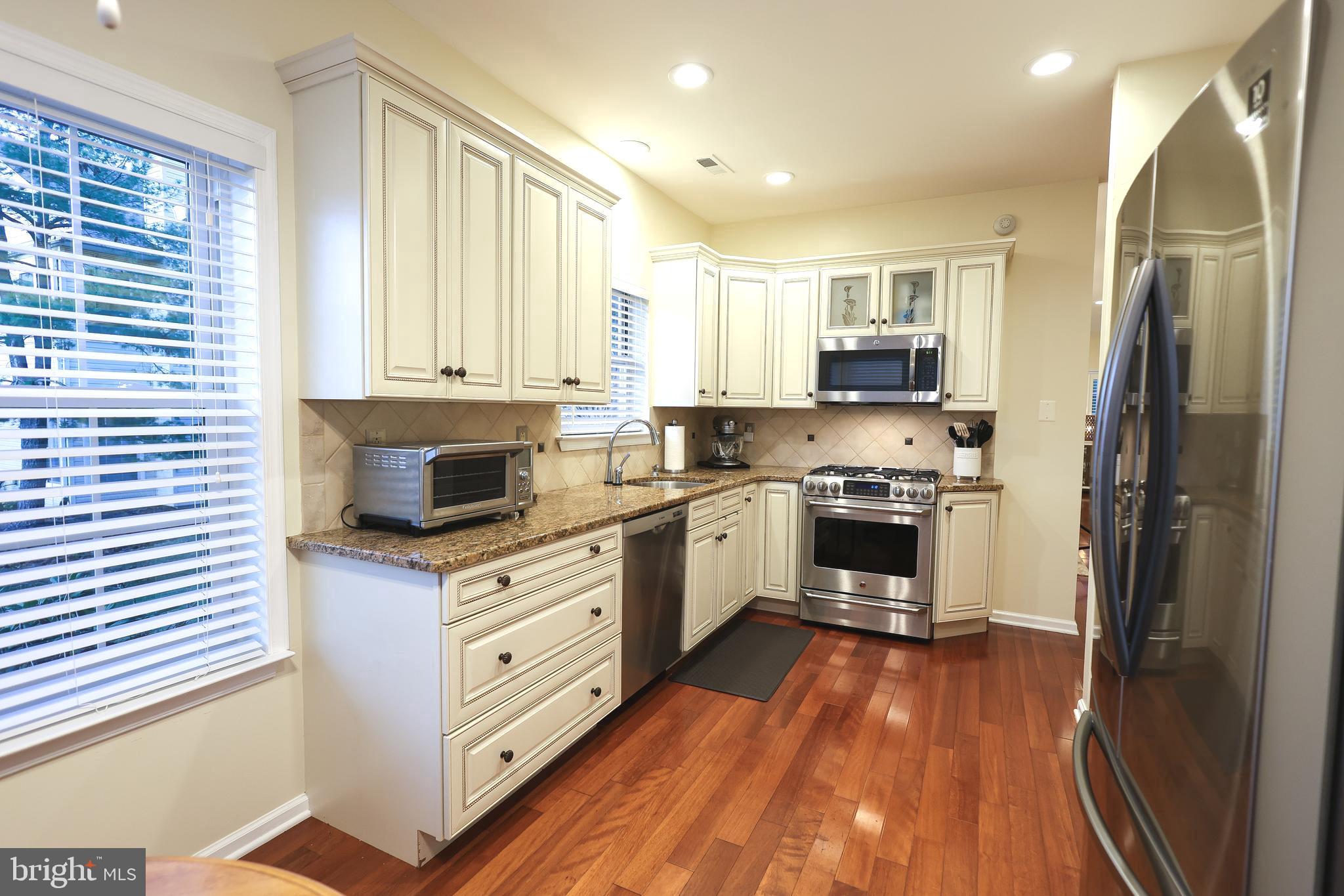 2602 Waterford Road Yardley, PA 19067 - Photo 8 of 33 a kitchen with stainless steel appliances a refrigerator sink and cabinets