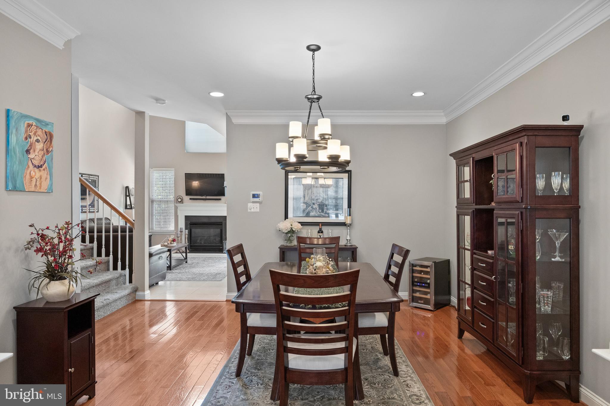 91 Weaver Drive Marlton, NJ 08053 - Photo 6 of 33 a dining room with furniture a chandelier and wooden floor