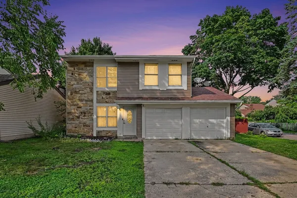 front view of a house with a garden