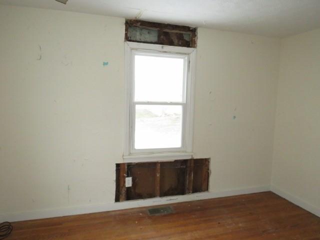 347 Clark Street Washington, PA 15301 - Photo 13 of 25 a view of an empty room with wooden floor and a window