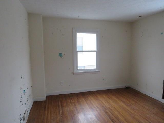 347 Clark Street Washington, PA 15301 - Photo 14 of 25 a view of an empty room with wooden floor and a window