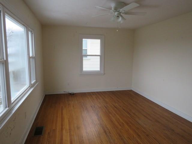 347 Clark Street Washington, PA 15301 - Photo 17 of 25 an empty room with wooden floor and windows