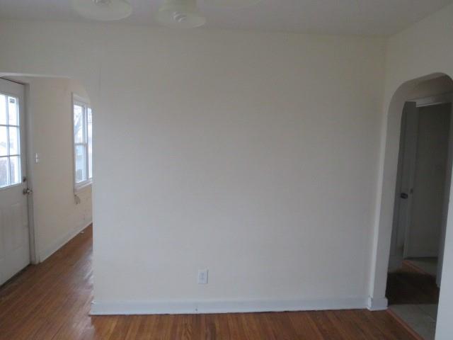 347 Clark Street Washington, PA 15301 - Photo 18 of 25 a view of an empty room with wooden floor and a window
