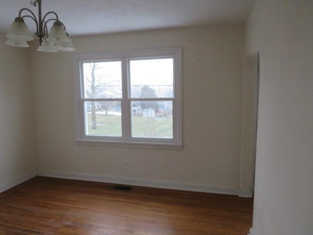 347 Clark Street Washington, PA 15301 - Photo 21 of 25 a view of an empty room with wooden floor and a window