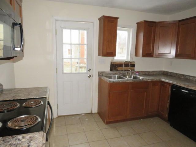 347 Clark Street Washington, PA 15301 - Photo 22 of 25 a kitchen with a sink and a stove