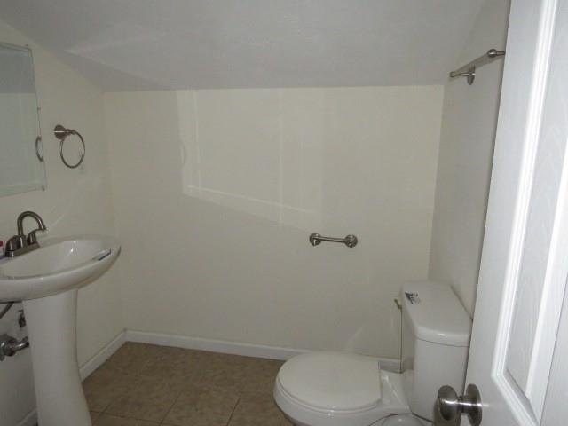 347 Clark Street Washington, PA 15301 - Photo 9 of 25 a bathroom with a toilet a sink and mirror