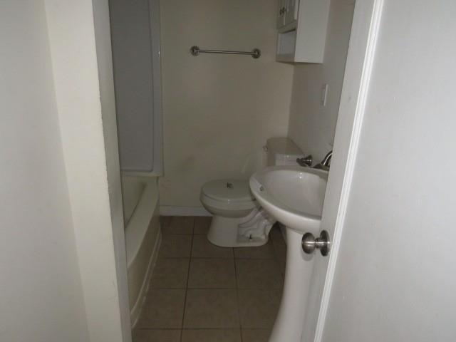 347 Clark Street Washington, PA 15301 - Photo 10 of 25 a bathroom with a toilet and a sink