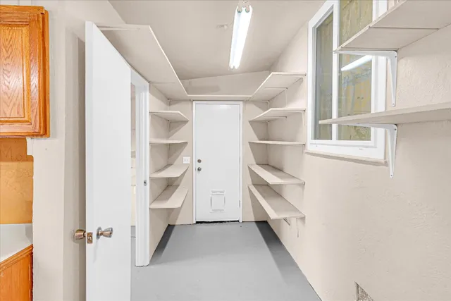 a view of an empty walk in closet