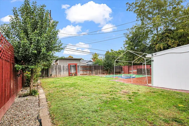 a view of a backyard of the house