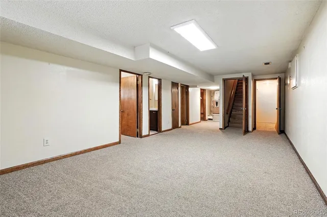 a kitchen with granite countertop cabinets and white appliances