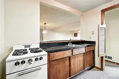 an empty room with an empty space and a ceiling fan