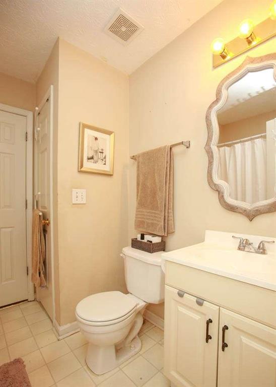 177 Rustin Drive Dallas, GA 30157 - Photo 16 of 26 a bathroom with a sink a toilet and a mirror