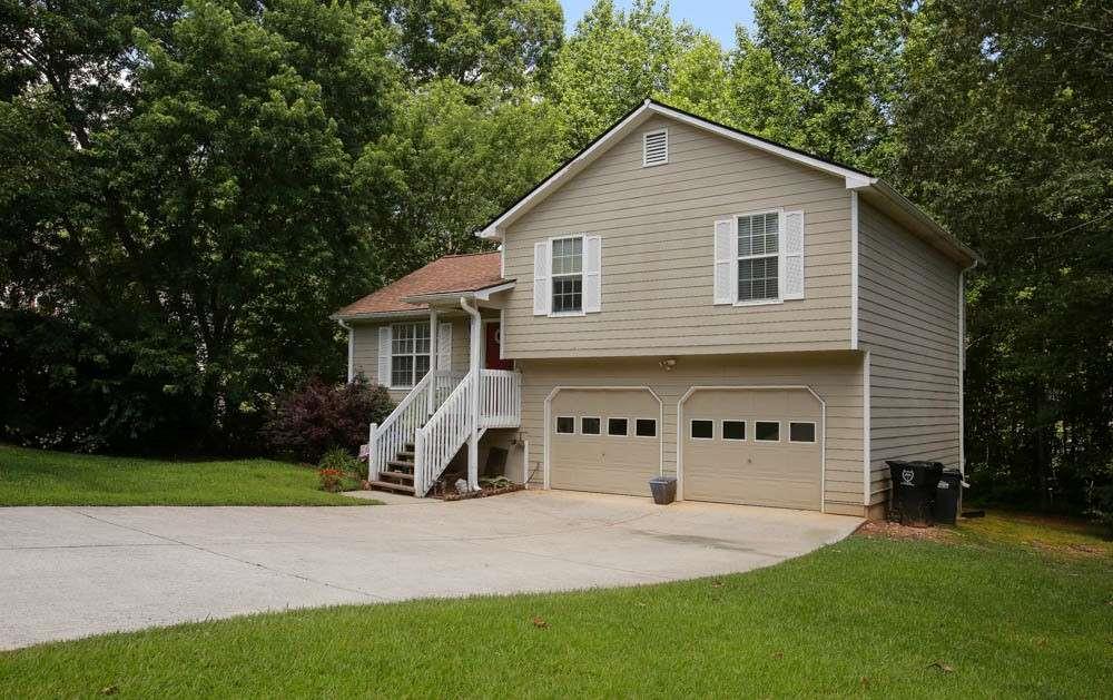 177 Rustin Drive Dallas, GA 30157 - Photo 3 of 26 a view of a house with a yard and tree s