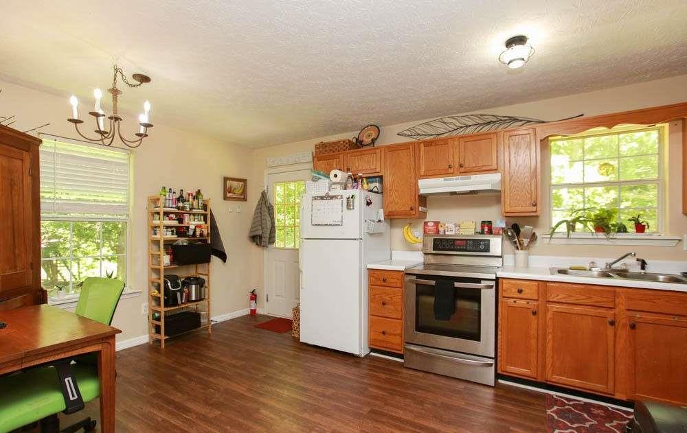 177 Rustin Drive Dallas, GA 30157 - Photo 8 of 26 a kitchen with stainless steel appliances a stove top oven and a refrigerator