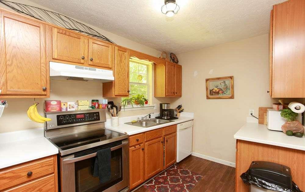 177 Rustin Drive Dallas, GA 30157 - Photo 10 of 26 a kitchen with a sink stove and microwave