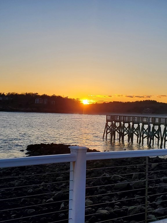 50 Shore Road Gloucester, MA 01930 - Photo 12 of 41 a view of a balcony with an ocean view