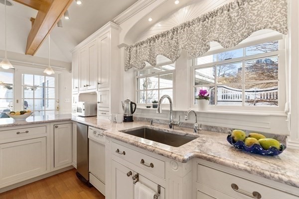 50 Shore Road Gloucester, MA 01930 - Photo 18 of 41 a kitchen with a sink and cabinets