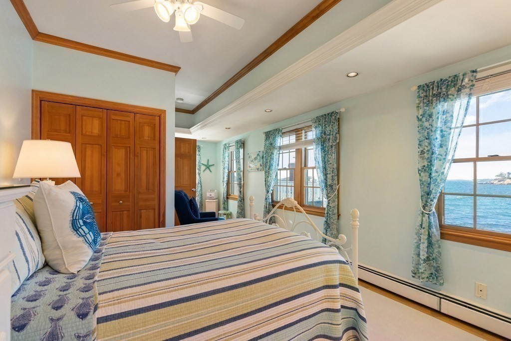 50 Shore Road Gloucester, MA 01930 - Photo 27 of 41 a bedroom with a bed and a window