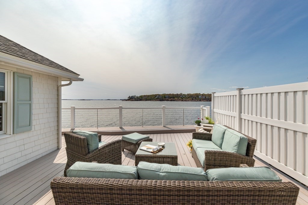 50 Shore Road Gloucester, MA 01930 - Photo 30 of 41 a roof deck with couches and wooden floor