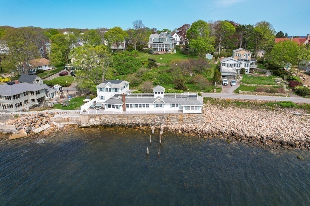 50 Shore Road Gloucester, MA 01930 - Photo 3 of 41 a view of a lake with a mountain in the background