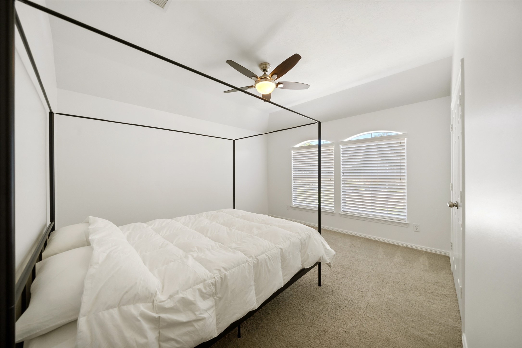 2302 Legends Shore Drive Spring, TX 77386 - Photo 38 of 48 Bright and inviting bedroom featuring large windows that fill the room with natural light.