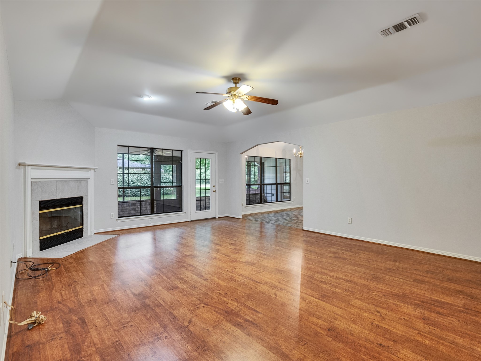 195 Coral Gables Trinity, TX 75862 - Photo 28 of 50 a view of empty room with wooden floor and fireplace
