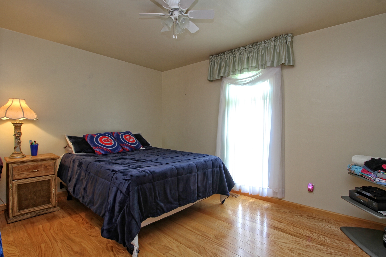 9763 West 1000S Road Bonfield, IL 60913 - Photo 13 of 23 a bedroom with a bed and a chandelier
