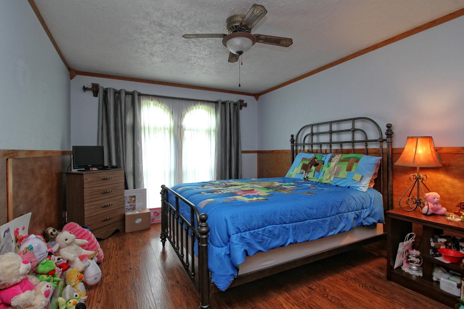 9763 West 1000S Road Bonfield, IL 60913 - Photo 15 of 23 a bedroom with a bed and dresser with wooden floor