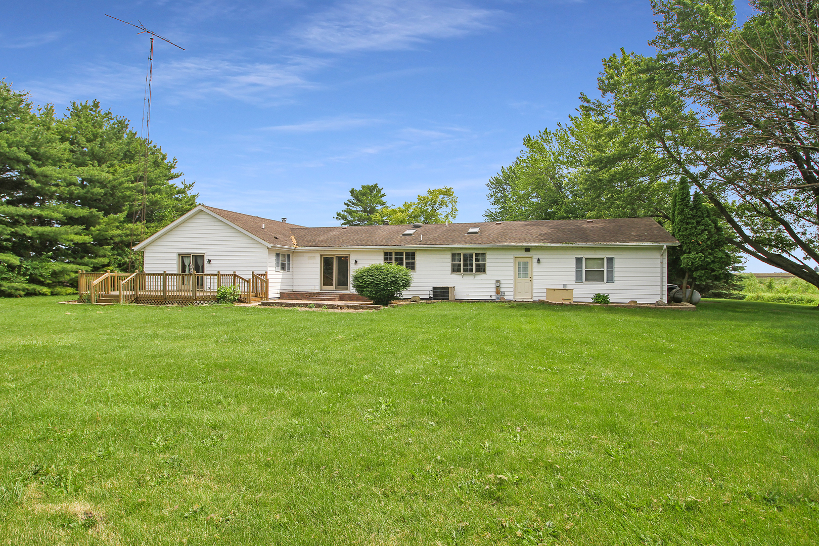 9763 West 1000S Road Bonfield, IL 60913 - Photo 20 of 23 a view of house with a big yard and large trees
