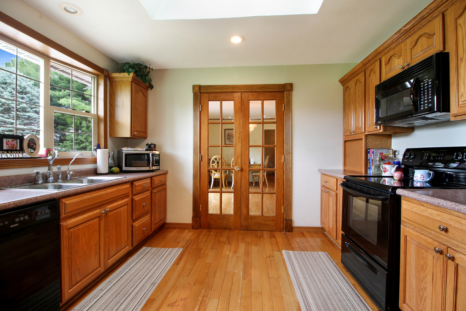 9763 West 1000S Road Bonfield, IL 60913 - Photo 5 of 23 a kitchen with stainless steel appliances granite countertop a stove a sink and a refrigerator