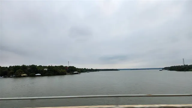 a view of a water fountain with a yard